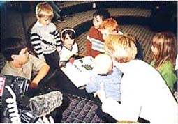Some of 'our babies' blowing out the candles on the birthday cake.