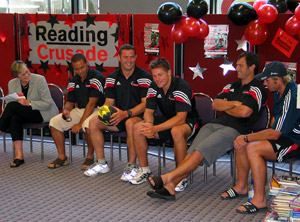 Libraries Manager Sue Sutherland with Crusaders Reuben Thorne, Richard McCaw, Leon MacDonald, Joe Maddock, and Justin Marshall