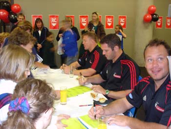 Signing autographs