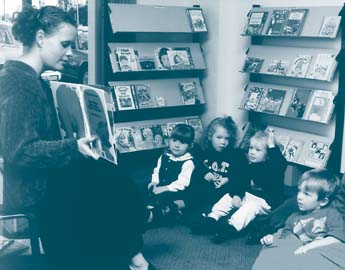 A story time session captivates young community library users.