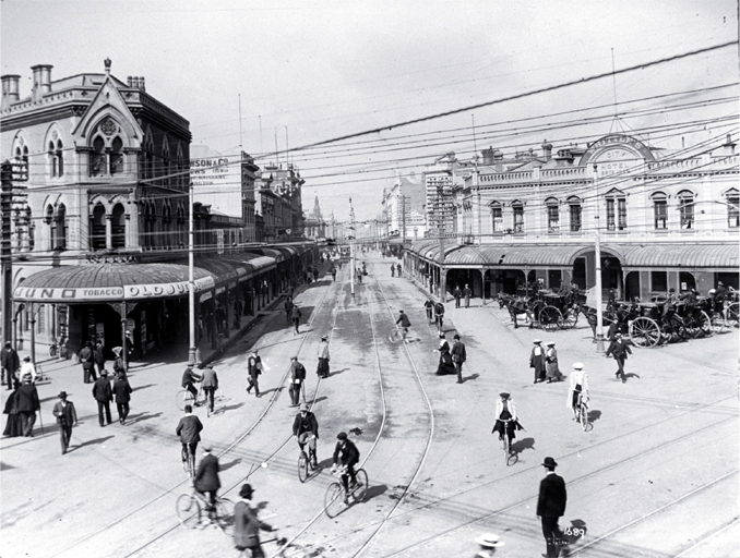 Looking down High Street while cyclists cross the intersection of Colombo and Hereford Streets Looking down High Street while cyclists cross the intersection of Colombo and Hereford Streets