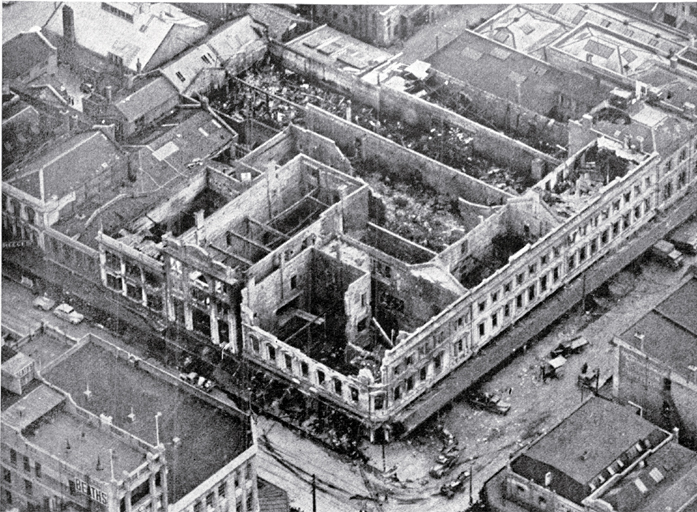 Aerial view of the gutted shell of the three-storied department building Aerial view of the gutted shell of the three-storied department building