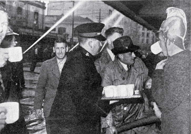 A Salvation Army worker provides tea for firemen and volunteers battling the fire A Salvation Army worker provides tea for firemen and volunteers battling the fire