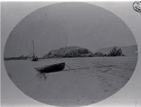 Small boat and dinghy beached near Cave Rock, Sumner, Christchurch