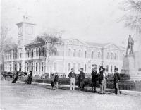 Cathedral Square, showing Post Office and Godley Statue with delivery carts and pedestrians