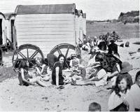 Bathing machines and sun bathers at Caroline Bay, Timaru