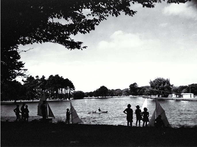 Children sailing model yachts on Victoria Lake, Hagley Park Children sailing model yachts on Victoria Lake, Hagley Park