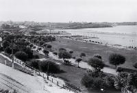 In 1877 working parties began cutting away the cliffs to form the lawns and gardens of Caroline Bay, Timaru 
