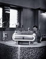 Woman serving expresso coffee at Fails Cafe, 82 Cashel Street, near the Bridge of Remembrance
[ca. 1955]