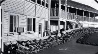 Children lying on stretchers outside the Fresh Air Home, Cashmere Sanatorium, Christchurch