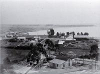 View from Maori Hill across to Dashing Rocks (the area of the Freezing Works), Timaru : to the right is a sawmill.