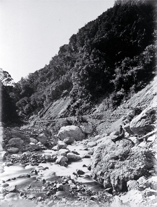 A roadman (?) sitting in the river bed beside the road through the Otira Gorge A roadman (?) sitting in the river bed beside the road through the Otira Gorge