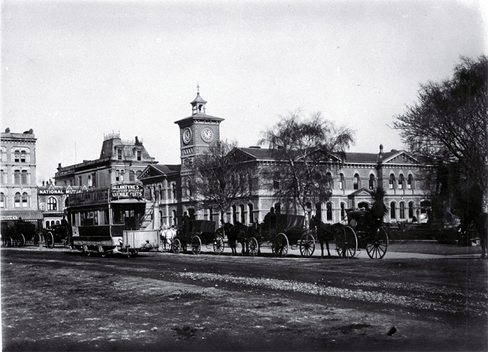 Horse-drawn trams, hackney & hansom cabs in front of the Godley Statue, Cathedral Square, Christchurch : the Post Office is behind. Horse-drawn trams, hackney & hansom cabs in front of the Godley Statue, Cathedral Square, Christchurch : the Post Office is behind.