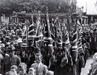 Girl Guides in the march to present the London Cenotaph flag to the Christchurch Cathedral for custody