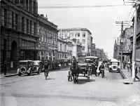 A horse and dray among the cars in Manchester Street, looking south towards the Clock Tower