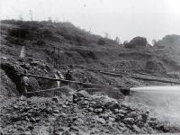 Hydraulic goldmining : sluicing for gold on the West Coast, Kumara area.
