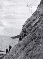 Roadmen building the road around the bluff between Cheviot and Port Robinson destroyed in the earthquake, 16 Nov. 1901