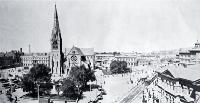 Cathedral Square from the top of the Royal Exchange building showing trams, Post Office and Cathedral, cabs