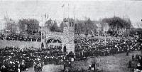 A procession turns through the Triumphal Arch to Market Square at Queen Victoria's Jubilee celebrations