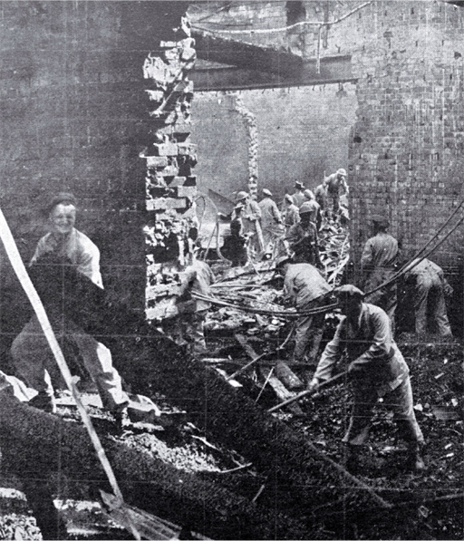 Soldiers work amongst the debris Soldiers work amongst the debris