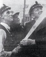 Sailors of the ships Bellona and Arbytus (Royal New Zealand Navy) help to attack the flames