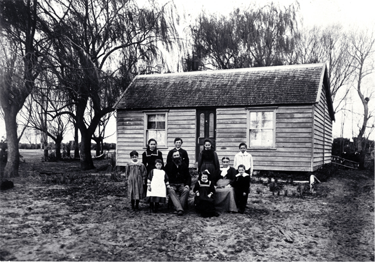 The family of Arthur John Inwood (1850-1932) and his wife Angelina (1860?-1919) pictured outside their dwelling The family of Arthur John Inwood (1850-1932) and his wife Angelina (1860?-1919) pictured outside their dwelling