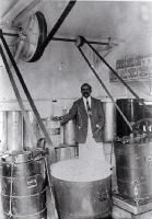 Sali Mahomet making icecream in his 'dairy' behind his house at 69 Caledonia Road, St Albans
