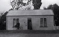 Amelia Frances Rogers with a postman, Mr  Heffenden, outside the Burwood  Post Office. Between 1924 and 1928