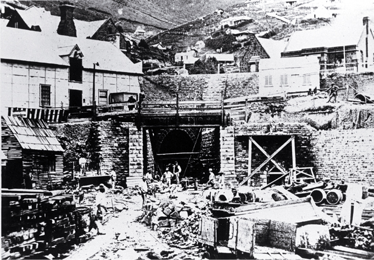 The Lyttelton portal of the Lyttelton Rail Tunnel with construction workers The Lyttelton portal of the Lyttelton Rail Tunnel with construction workers