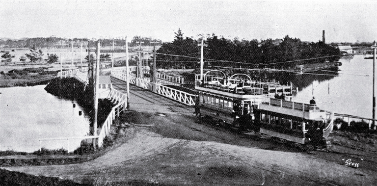 An electric tram crosses the Ferry Bridge over the Heathcote River on the road to Sumner, Christchurch An electric tram crosses the Ferry Bridge over the Heathcote River on the road to Sumner, Christchurch