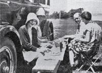 A family picnic on a summer's day at Addington Show Grounds' motorist's camping ground, Christchurch