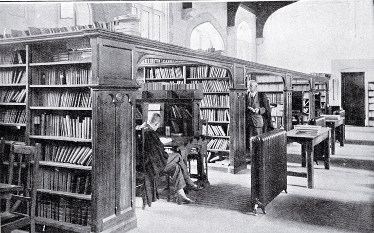 In the Canterbury College Library : the Acting Librarian, Mr Hardie, is seen facing the camera. In the Canterbury College Library : the Acting Librarian, Mr Hardie, is seen facing the camera.
