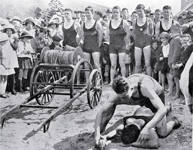 A demonstration of artificial respiration at the opening of the lifesaving season : team lined up behind the reel. A demonstration of artificial respiration at the opening of the lifesaving season : team lined up behind the reel.