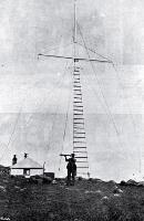 G R Toomey watching for the descent of Capt Lorraine's balloon at the signal station between Little Port Cooper and Port Levy, 1899