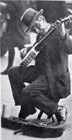 A busker with a banjo entertaining in Cathedral Square, Christchurch