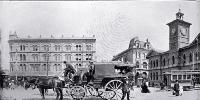 The Opawa coach waiting to depart in Cathedral Square : in background is Mortens Building (United Service Hotel)