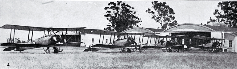 The New Zealand air arm of defence : Avro 504K aeroplanes lined up outside hangars. The New Zealand air arm of defence : Avro 504K aeroplanes lined up outside hangars.