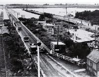 The old Rakaia combined road & rail bridge :at right the new road is under construction. [ca. 1938]