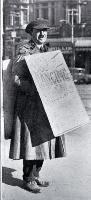 A sandwich-board man advertising dancing shoes in Cathedral Square, Christchurch