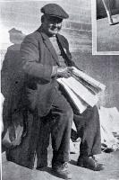 A newspaper vendor in Cathedral Square, Christchurch