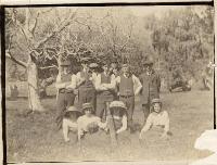 Group outdoors with cricket bat