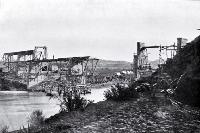 Construction of the Waipara-Cheviot railway bridge over the Hurunui River, using steel spans on timber and concrete piers 