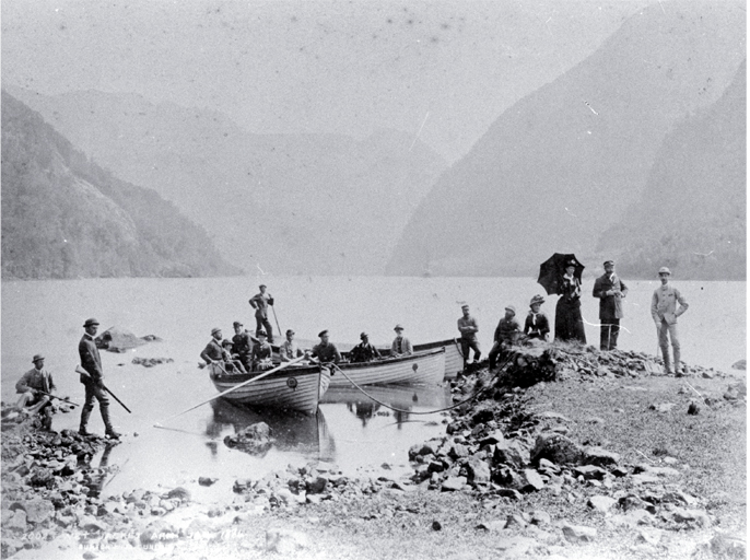 Tourists in small boats hunting in Wet Jacket Arm, Dusky Sound, Fiordland Tourists in small boats hunting in Wet Jacket Arm, Dusky Sound, Fiordland