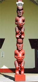 Aoraki, carving detail: Waitaha (shown with feathers on his head) and below him, Rakiura.