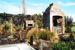 The memorial garden established among the foundations and chimney stack remains of the historic Awhitu House, Taumutu.