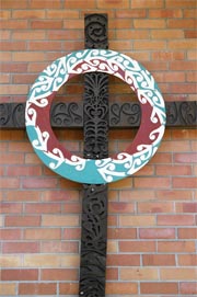 Carved cross on the frontage of Te Rangimārie Centre
