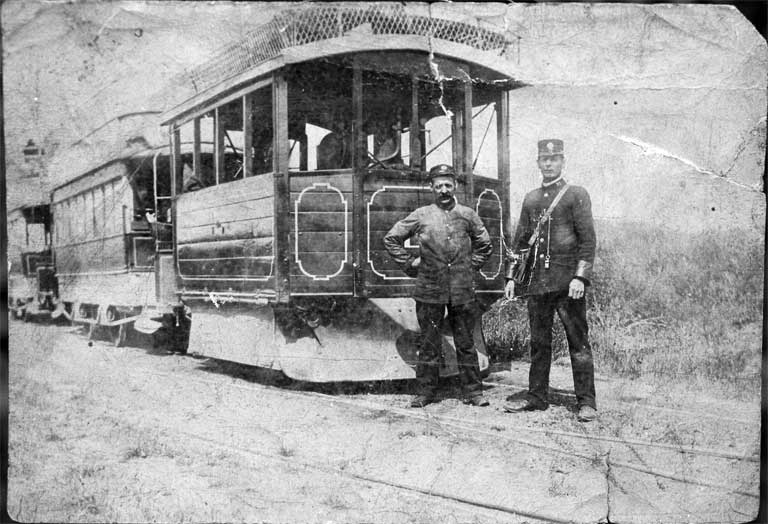 A Kitson steam tram hauling two saloon double-deckers A Kitson steam tram hauling two saloon double-deckers