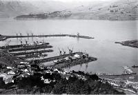 Ships berthed at Lyttelton Harbour : Diamond Harbour can be seen in the distance.