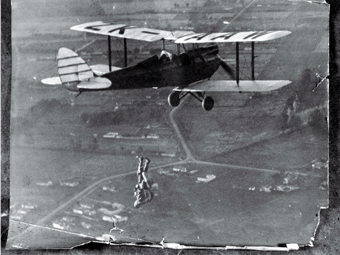 Parachutist free-falling from a Tiger Moth over Christchurch Parachutist free-falling from a Tiger Moth over Christchurch