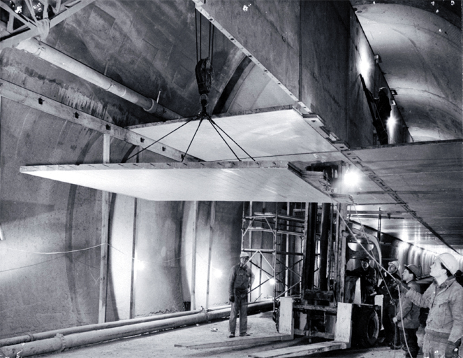 Ceiling panels being lifted into place during the construction of the Christchurch-Lyttelton Road Tunnel Ceiling panels being lifted into place during the construction of the Christchurch-Lyttelton Road Tunnel